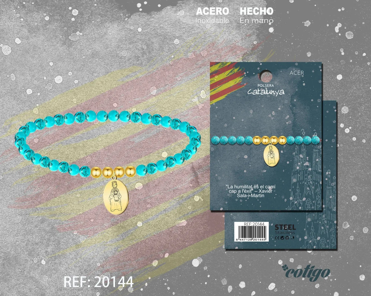 Pulsera elástica de cuentas color turquesa con medalla colgante de la Virgen de Montserrat en acero inoxidable dorado y detalles de bolas doradas, presentada en tarjeta de regalo.