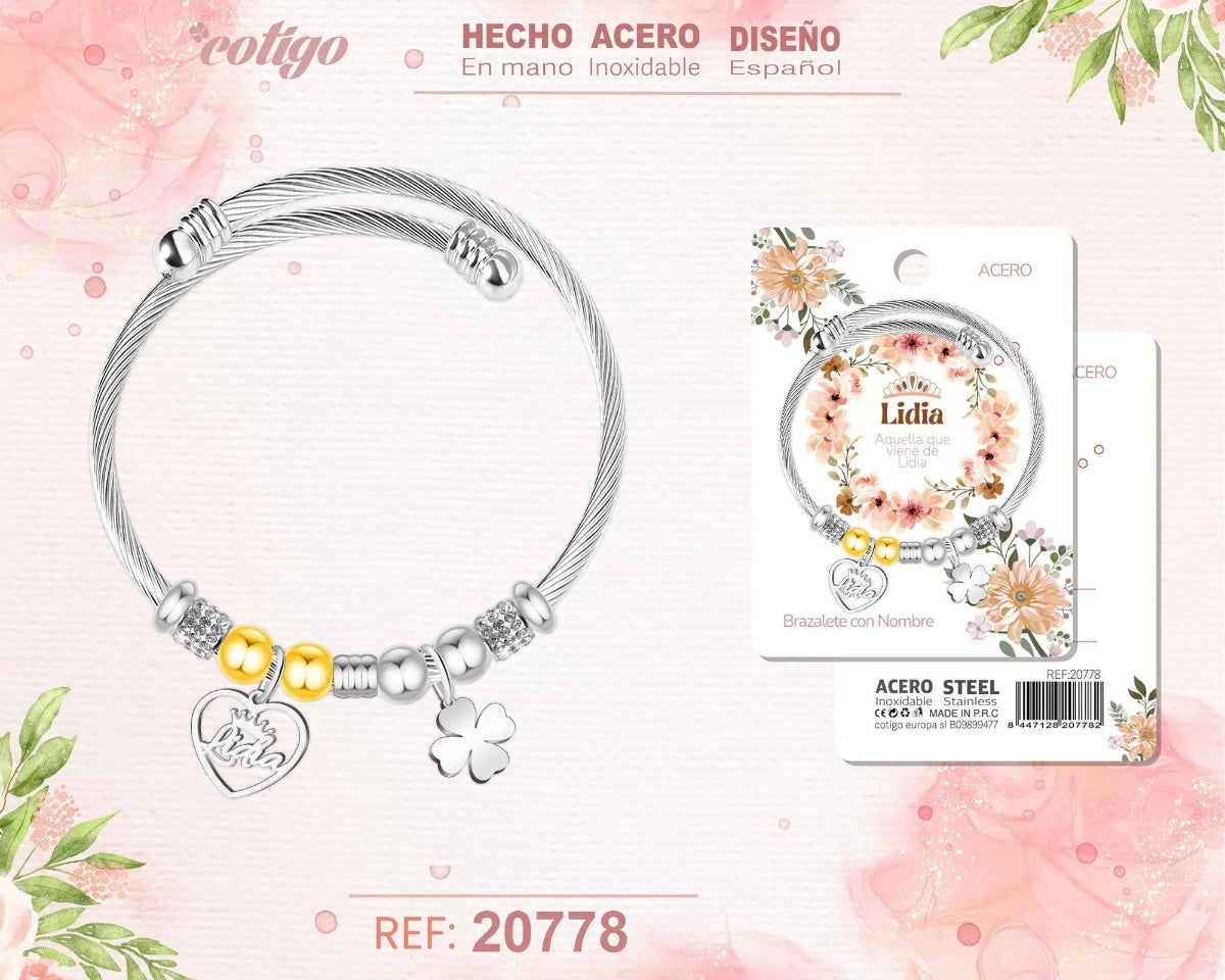 Brazalete rígido de acero inoxidable estilo cable trenzado con el nombre Lidia, colgante de corazón, trébol de la suerte y detalles brillantes.