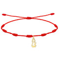 Pulsera de hilo rojo de 7 nudos con colgante de silueta de la Virgen del Pilar en acero dorado