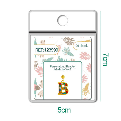 CHARM de Letra B Acero color Dorado con Circonita-con Bola de Goma