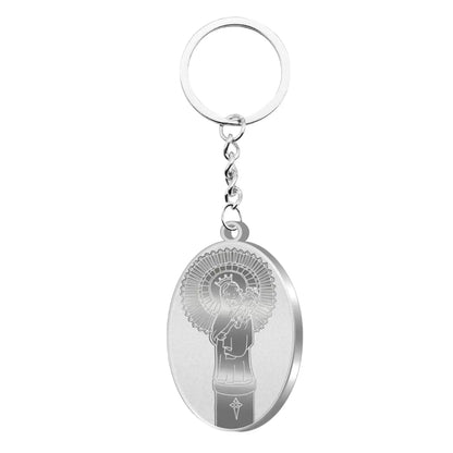 Llavero de acero inoxidable plateado con la silueta de la Virgen del Pilar (troquelada o grabada). Acabado pulido brillante.