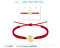 Pulsera de hilo trenzado rojo con amuleto redondo de ojo turco calado y radiante en acero inoxidable dorado y cierre ajustable.
