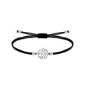 Pulsera de hilo encerado negro con conector de Eguzkilore plateado en acero inoxidable, tarjeta con frase sobre el destino