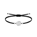Pulsera de hilo encerado negro con conector de Eguzkilore plateado en acero inoxidable, tarjeta con frase sobre el destino