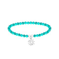 Pulsera de cuentas turquesas con Eguzkilore plateado, tarjeta con frase inspiradora en euskera sobre el éxito, la felicidad y la lealtad