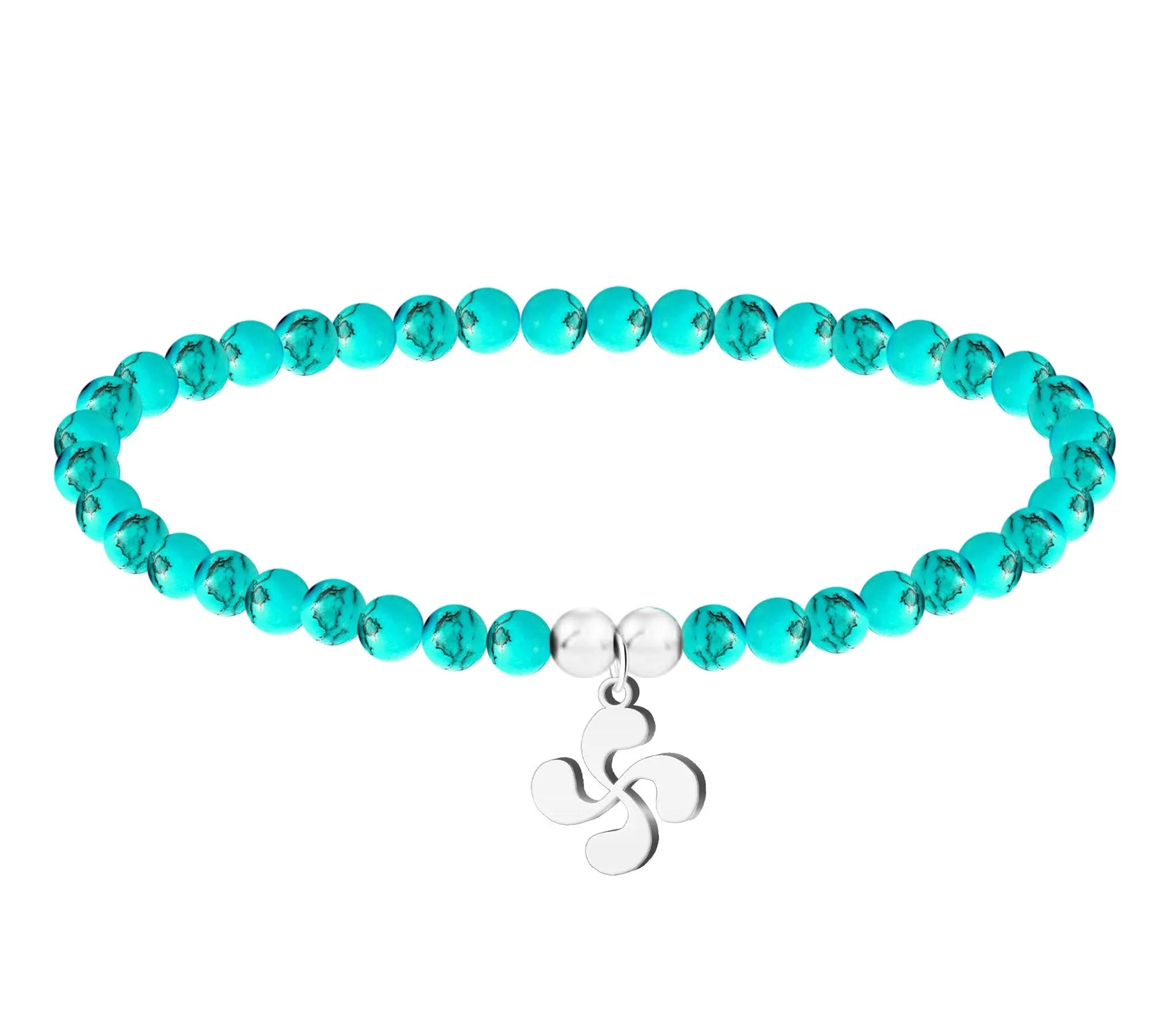 Pulsera de cuentas turquesas con colgante Lauburu plateado, tarjeta con frase desafiante en euskera "Begietara begira" sobre la pertenencia y la valentía