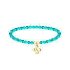 Pulsera de hilo color turquesa con entrepieza de Lauburu dorado, tarjeta con frase en euskera sobre la superación y el futuro