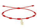 Pulsera de hilo rojo 7 nudos con charm minimalista de la Virgen de la Victoria en acero dorado