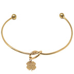Brazalete Nudo con Trébol en Acero Inoxidable en acabado dorado – vista principal del diseño nudo con trébol