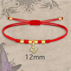 Pulsera Nudo de Bruja con Hilo Rojo en Acero Dorado acabado