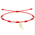 Pulsera de hilo rojo ajustable con charm de salamanquesa dorada