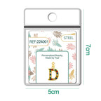 CHARM de Letra D Acero color Dorado con Circonita-con Cierre - cotigo