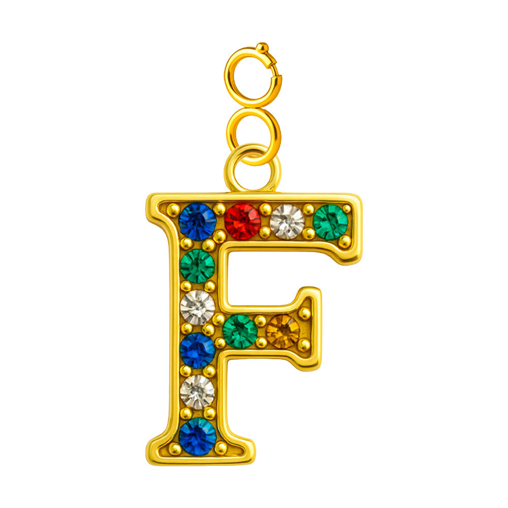 Charm colgante de letra F con detalle de circonita, acabado dorado y cierre de acero