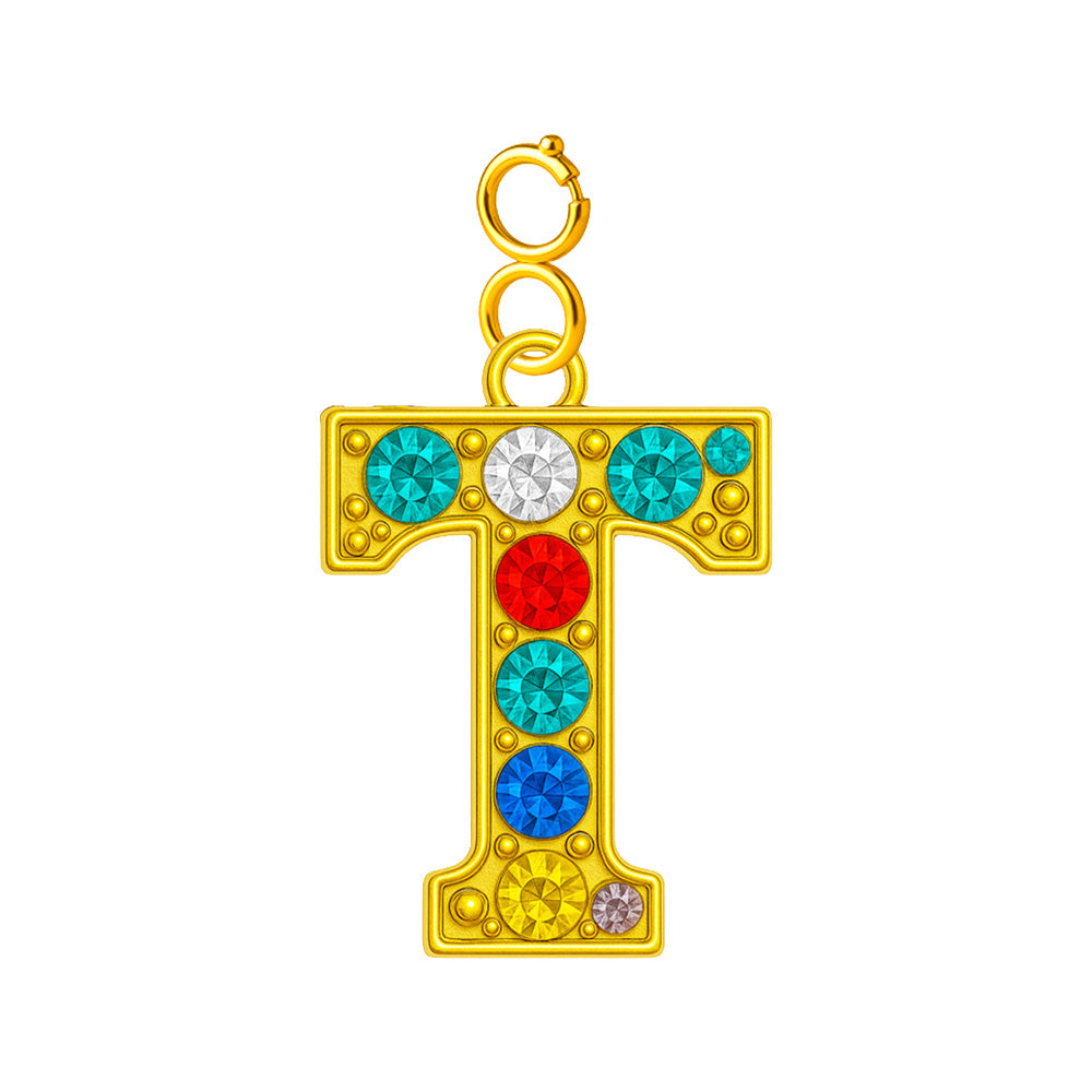 Charm colgante de letra T con detalle de circonita, acabado dorado y cierre de acero