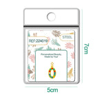 Charm dorado de número 0 con circonitas de colores con cierre de acero, en blíster