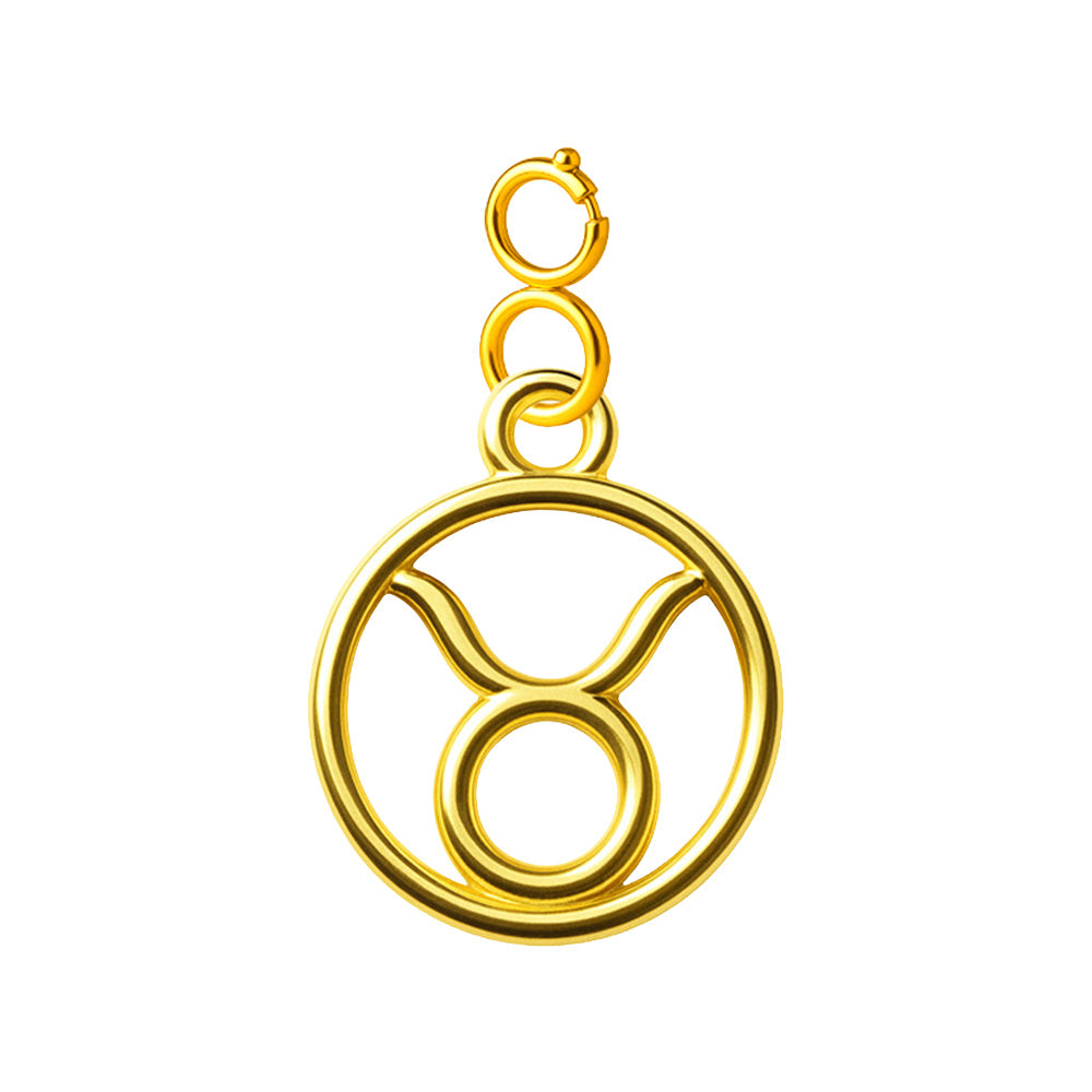 Charm colgante dorado con símbolo de Tauro y cierre superior de acero sobre fondo blanco