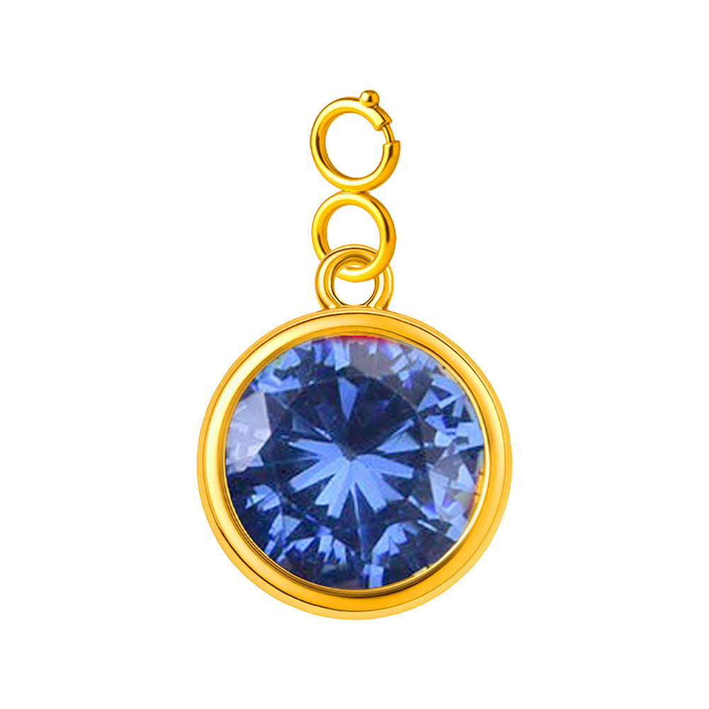 Charm colgante dorado con piedra de nacimiento facetada de Diciembre y cierre de acero, sobre fondo blanco