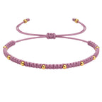 Pulsera de Hilo Encerado con Cuentas de Acero Inoxidable en acabado morado – vista principal