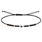 Pulsera de Hilo con Cuentas y Ojo Turco en acabado negro – vista principal del diseño hilo con cuentas y ojo turco