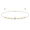 Pulsera de Hilo con Piedras Naturales y Bola de Acero - Color Blanco - SKU 23890