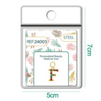 CHARM de Letra F Acero color Dorado con Circonita - cotigo