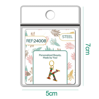 CHARM de Letra K Acero color Dorado con Circonita
