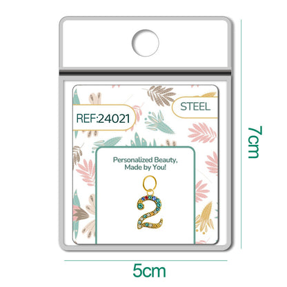 CHARM de Número 2 Acero color Dorado con Circonita