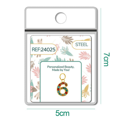 CHARM de Número 6 Acero color Dorado con Circonita
