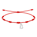 Pulsera de hilo rojo con 7 nudos de la suerte y pequeño charm colgante de la silueta de la Virgen de Candelaria en acero inoxidable plateado.