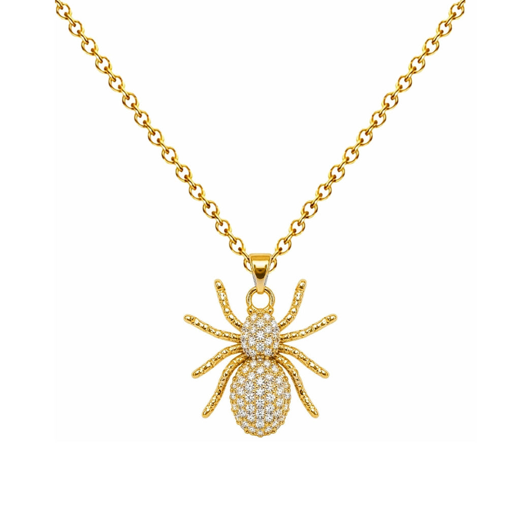 Collar de araña dorada con circonitas, detalle del colgante sobre fondo blanco.