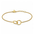 Pulsera fina dorada de acero inoxidable con motivo central de doble aro entrelazado.