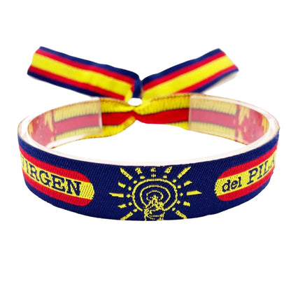 Pulsera de tela azul oscuro estilo Policía Nacional con la Virgen del Pilar y bandera de España bordada. Ajustable con nudos.