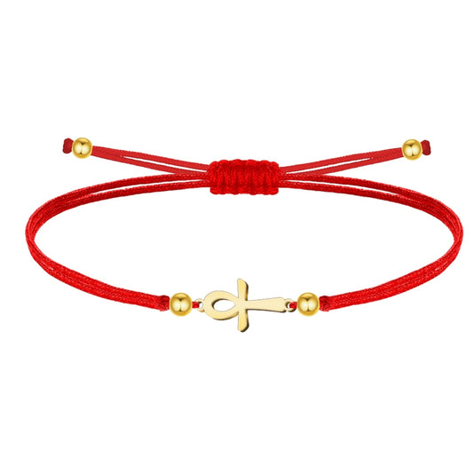 Pulsera de hilo rojo liso con una Cruz Egipcia (Ankh) central en acero inoxidable de color dorado, decorada con esferas metálicas doradas y cierre ajustable de nudo corredizo.