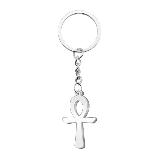 Llavero de metal con colgante de la Cruz Egipcia (Ankh) fabricado en acero inoxidable de color plateado, unido a una argolla circular mediante una cadena de eslabones corta.