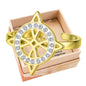 Anillo Nudo de Bruja con circonitas en acero dorado
