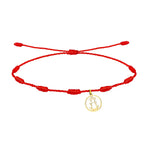 Pulsera de hilo rojo 7 nudos con charm de silueta calada de la Virgen de la Fuensanta en acero dorado