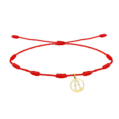 Pulsera de hilo rojo 7 nudos con charm de silueta calada de la Virgen de la Fuensanta en acero dorado
