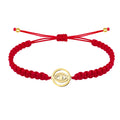 Pulsera de hilo rojo con Ojo Turco calado en acero dorado.