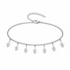 Pulsera con 7 Colgantes de Serpiente en Acero Inoxidable sobre fondo blanco