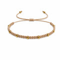Pulsera de Hilo Encerado con Cuentas de Acero Inoxidable - Beige sobre fondo blanco