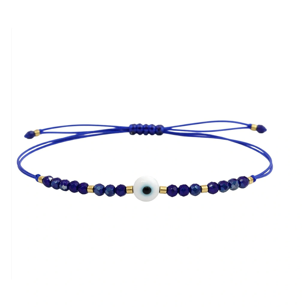 Pulsera de Hilo con Cuentas y Ojo Turco - Azul Marino sobre fondo blanco