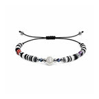 Pulsera de Hilo con Cuentas Heishi y Bola de Acero - Negro sobre fondo blanco