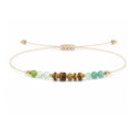 Pulsera de Piedras Naturales con Cuentas de Madera sobre fondo blanco