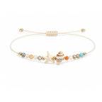 Pulsera de Piedras Naturales con Estrella de Mar y Concha sobre fondo blanco