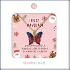 Colar de borboleta em tons cor-de-rosa e azuis, apresentado num cartão de Natal.