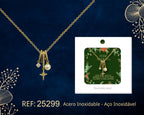 Collar dorado de estrella y esfera clara junto a su tarjeta de regalo, sobre fondo oscuro.