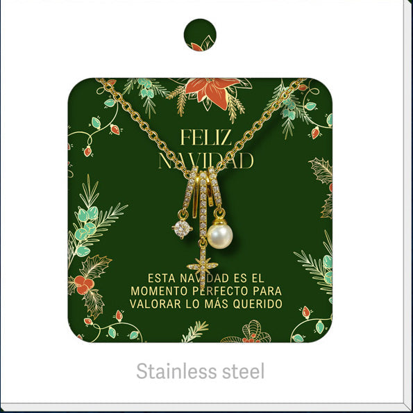 Collar dorado de estrella y esfera clara, presentado en tarjeta navideña.