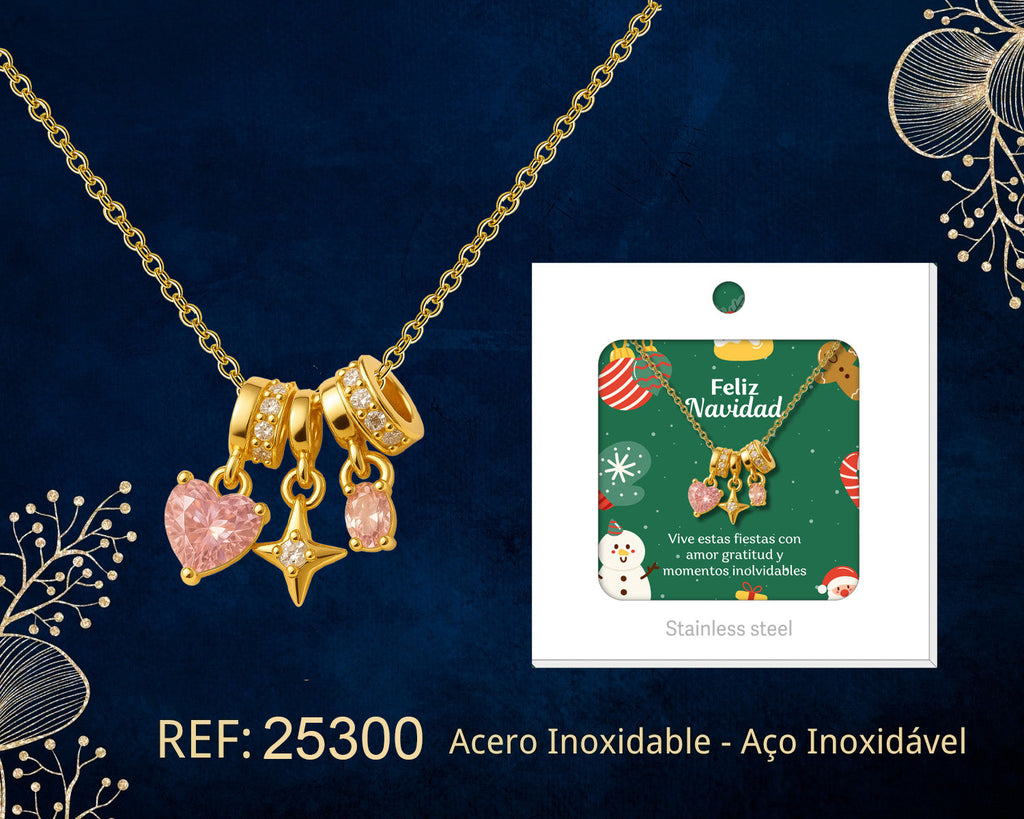 Colar dourado de coração cor-de-rosa e estrela junto do seu cartão para oferta, sobre fundo escuro.