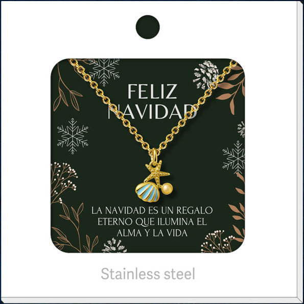 Collar dorado de concha y estrella de mar, presentado en tarjeta navideña.