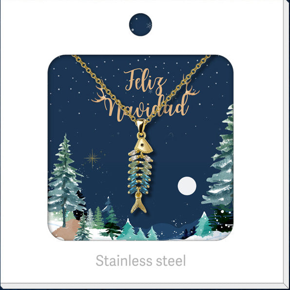Collar dorado de pez con cuerpo segmentado, presentado en tarjeta navideña.